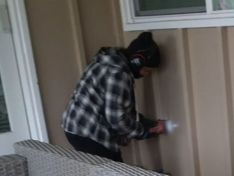 Professional electrician installing an exterior outlet in Winchester