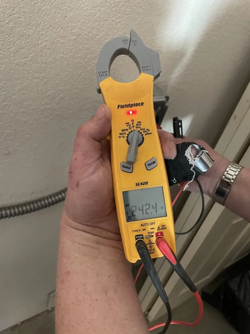Voltage testing with clamp meter during Ceiling Fan Installation in Winchester